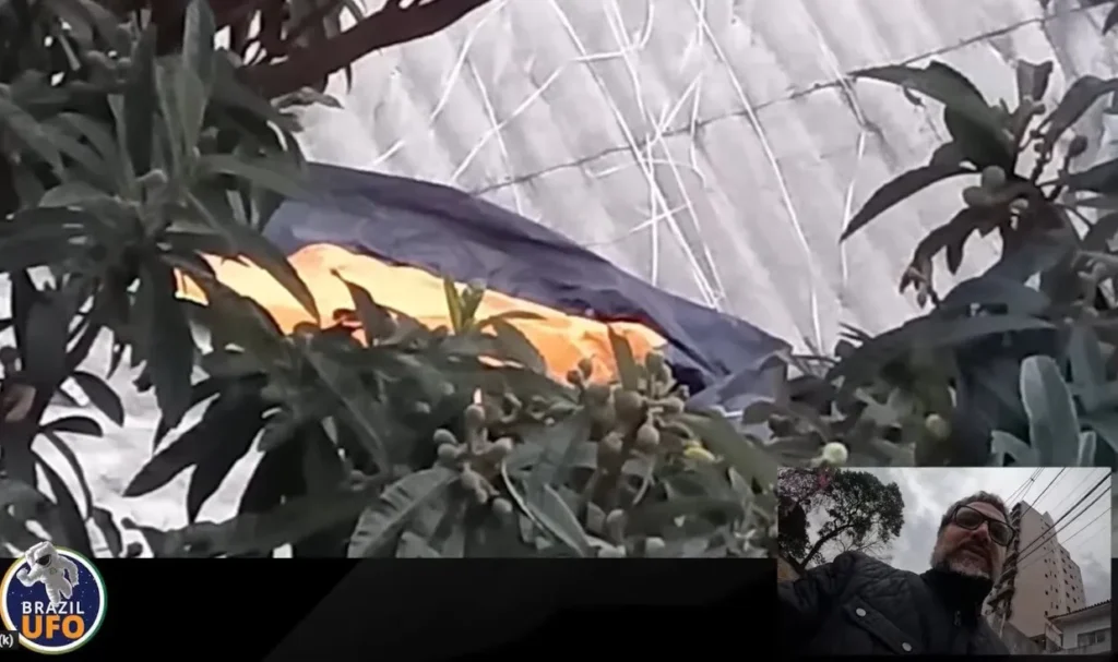 Canal Brazil UFO esclarece mistério do OVNI do Sacomã 4 Imagem esclarecedora: paraquedas provavelmente liberado por um balão caiu em telhado na região (captura PodCast Brazil UFO - Youtube)